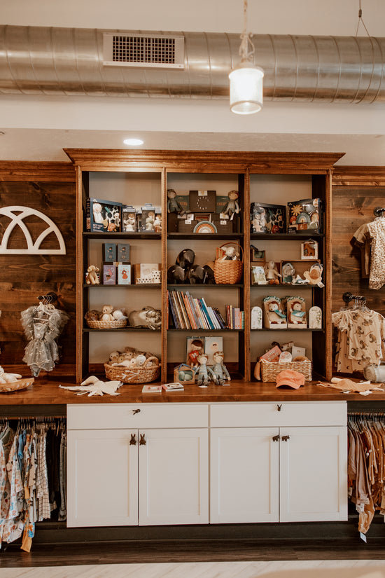 Shopping at a children's boutique in Greensburg, showcasing a variety of stylish clothing and accessories for kids at Trendy Bunny Studio.